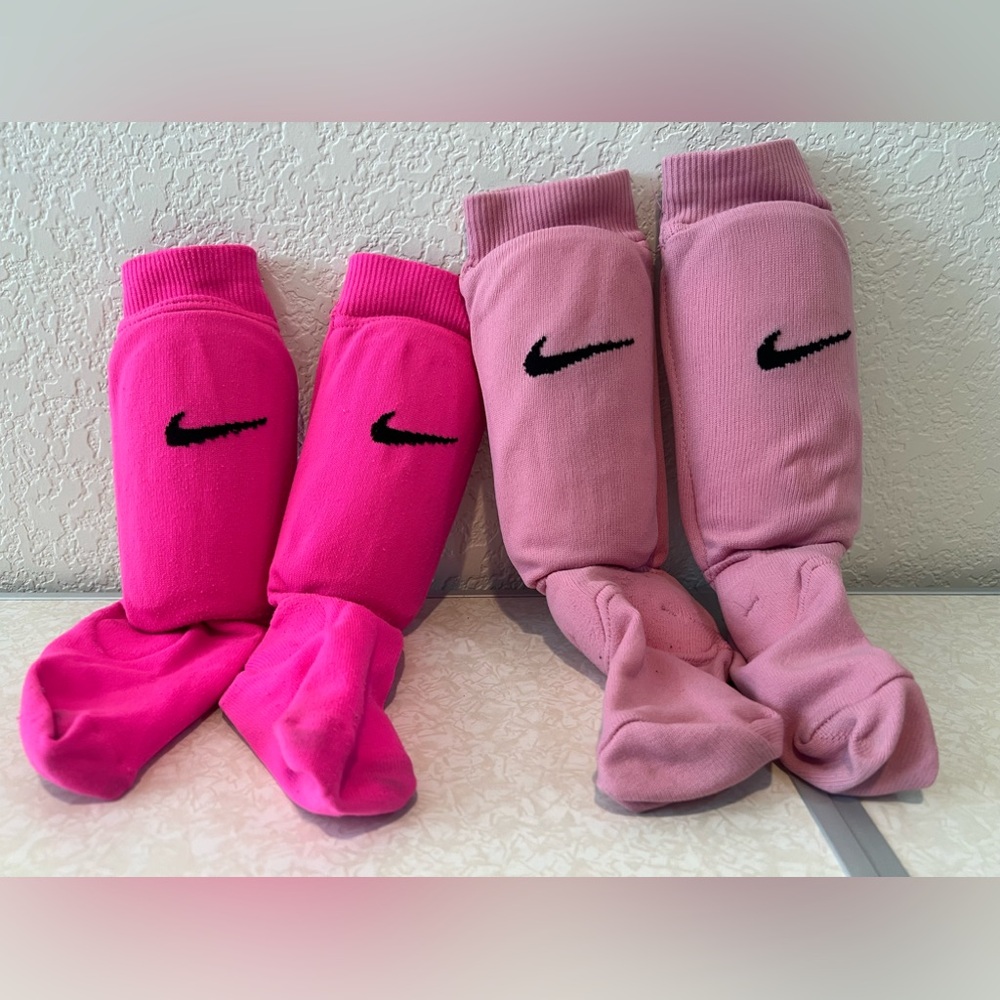 2 pairs of Nike Soccer socks with built in shinguards